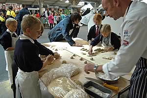 Andrew Wood, chef from the University of York sharing bread making skills with youngsters