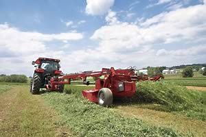 Case Puma 115 tractor with DC132 flail mower conditioner