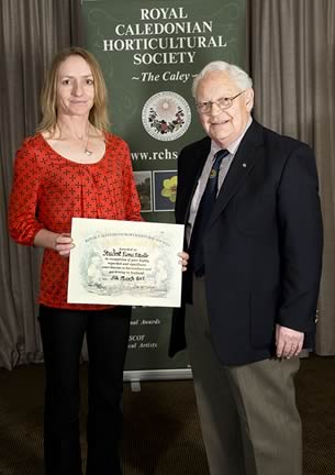 Fiona Fitzelle receives her prize from Jim McColl